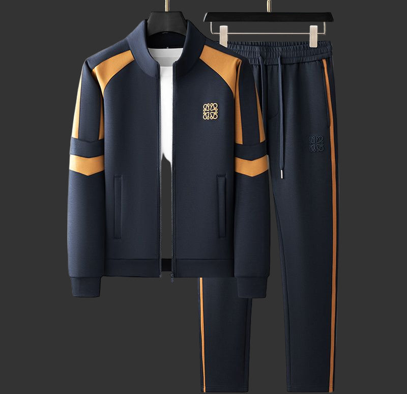 Navy tracksuit with yellow accents on a gray background