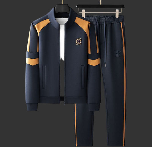 Navy tracksuit with yellow accents on a gray background